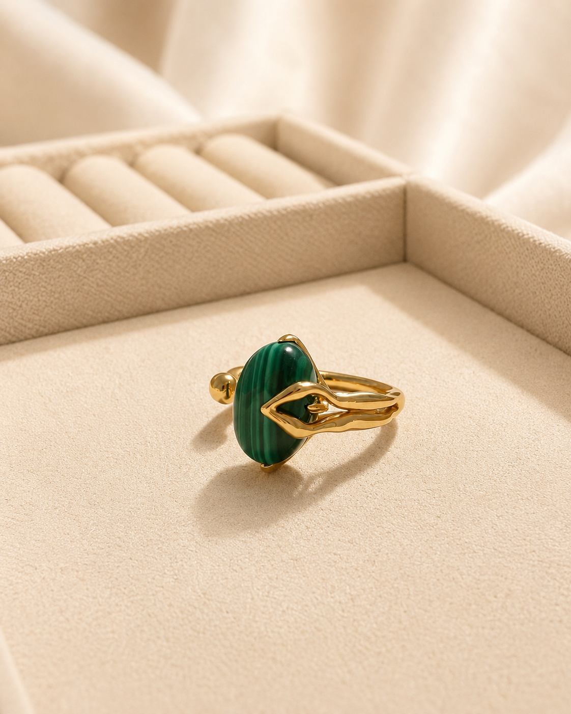Oval natural malachite with rich green banding on gold-plated S925 silver. Sculptural prongs, open adjustable band.