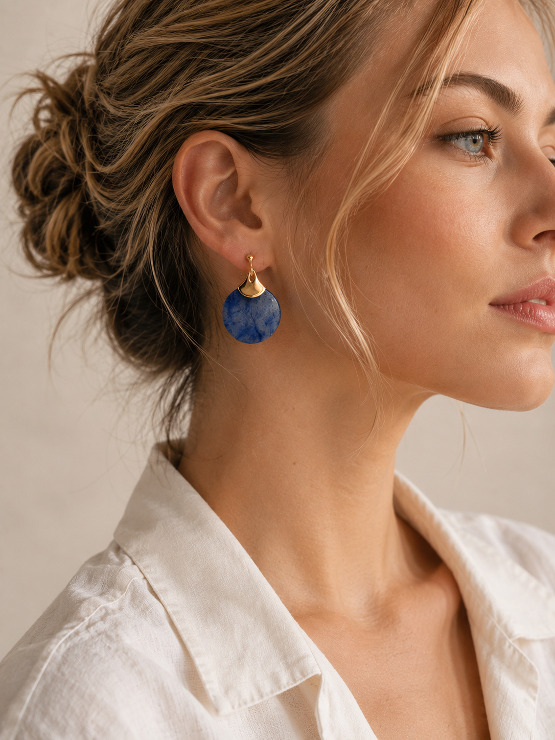 Natural blue aventurine disc earrings with a gold fan accent, on gold-plated S925 silver. Secure post closure.