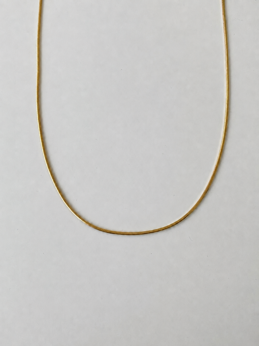 Flat snake chain necklace in S925 silver, 18K gold or white gold plated. 40cm with 6cm adjustable extender.