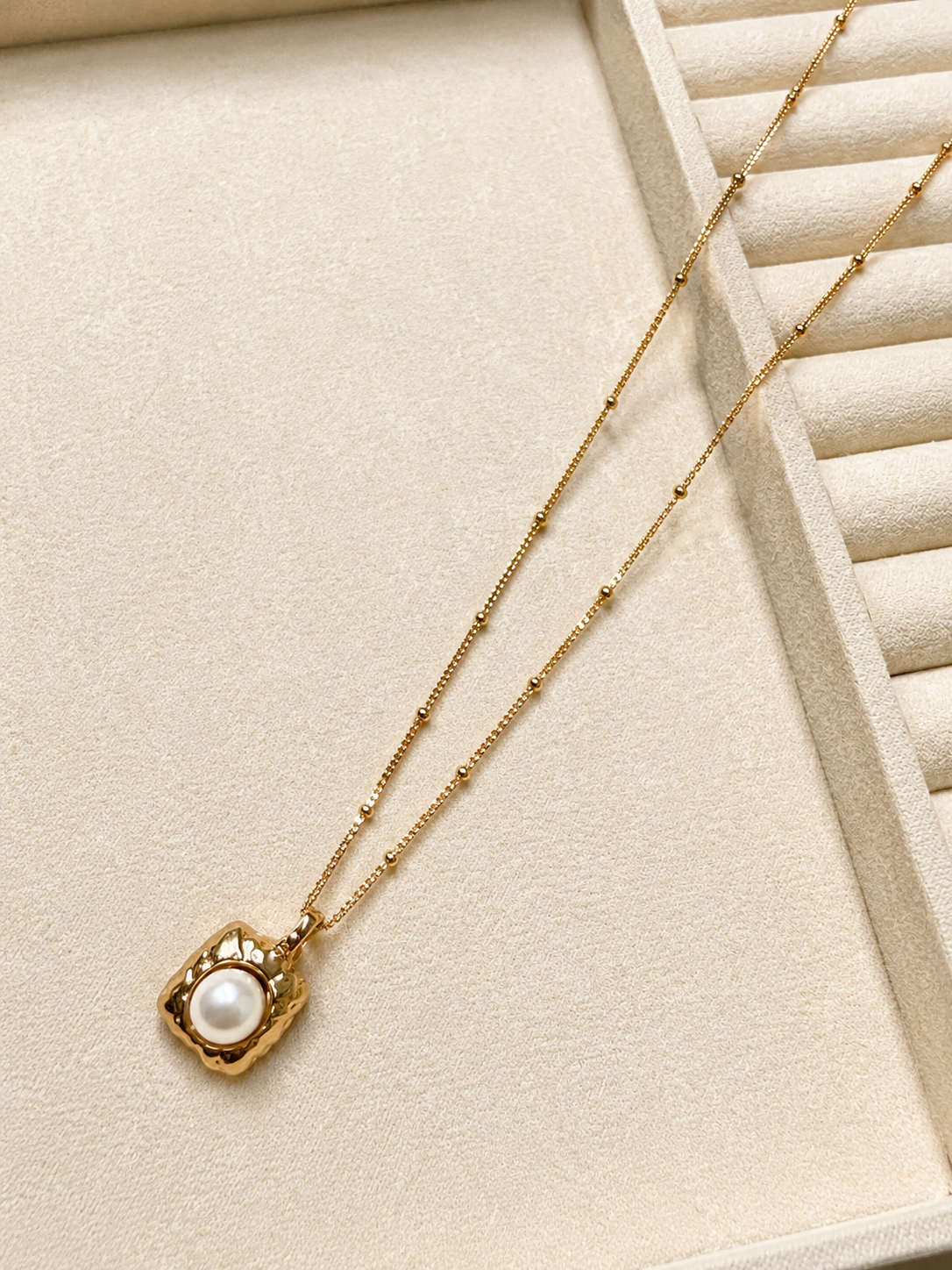 Hammered gold tag pendant with a freshwater pearl, on a beaded S925 silver chain. 40cm with extender.
