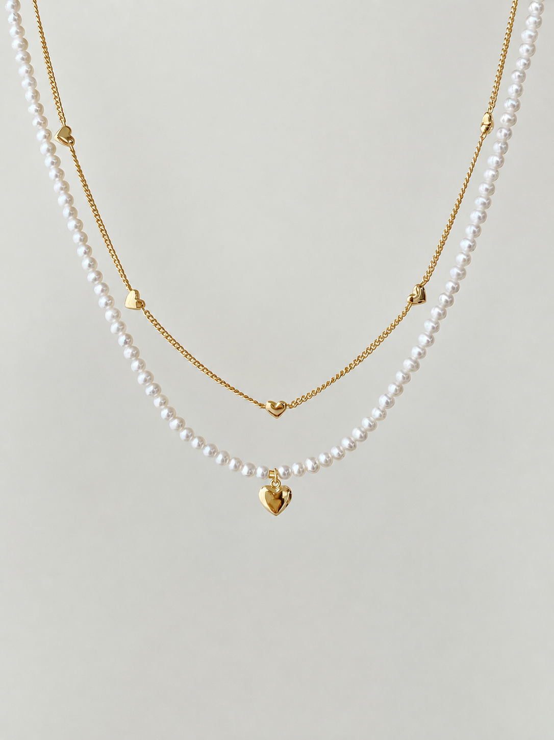 Double-strand heart station necklace in S925 silver, 18K rose gold or white gold plated. 38cm with extender.